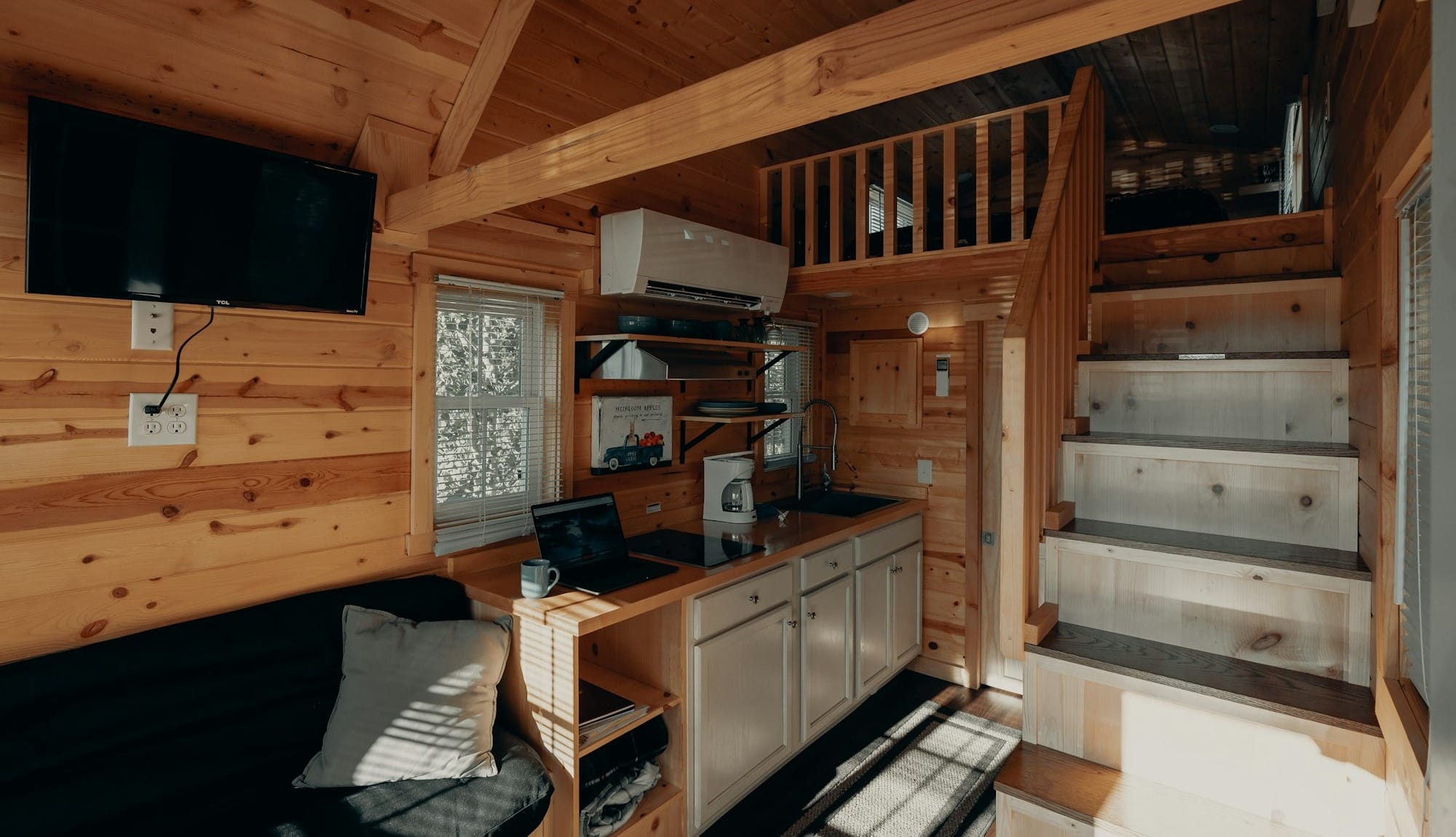 black flat screen tv on brown wooden tv rack